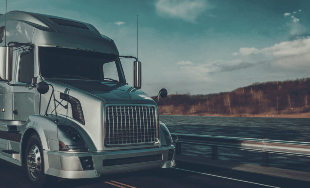 trucking company owner reviewing factoring paperwork and USDOT records before selling invoices